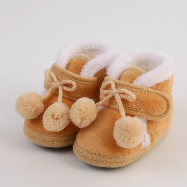 chausson bébé avec pompon
