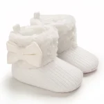 chaussons bébé en laine avec nœud papillon en fourrure